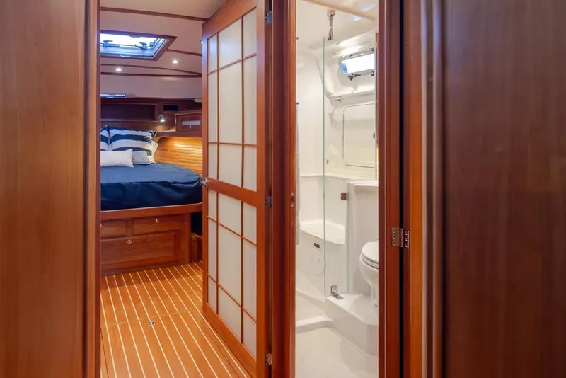 Slide: The Image of 2020 Sabre 45 Salon Express interior with bedroom and bathroom view. - 28
