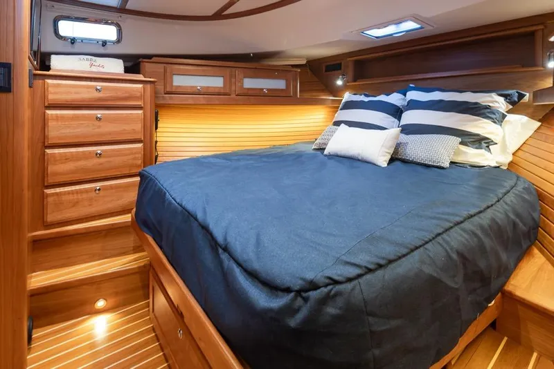 Slide: The Image of Luxurious cabin interior of 2020 Sabre 45 Salon Express yacht with cozy bedding. - 31
