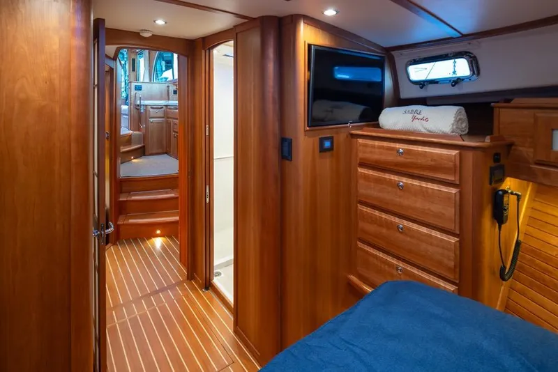 Slide: The Image of Interior of 2020 Sabre 45 Salon Express yacht with wooden cabinetry and modern amenities. - 32