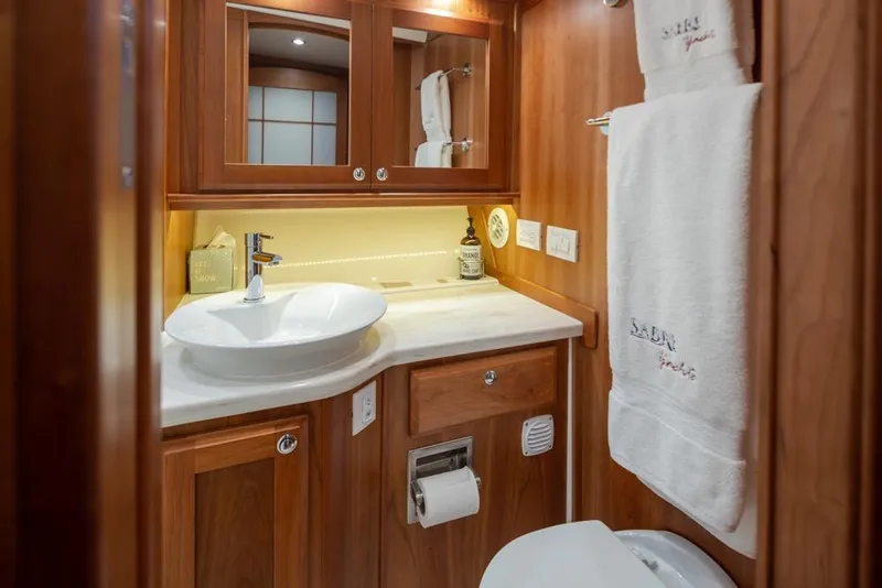 Slide: The Image of Luxurious bathroom in 2020 Sabre 45 Salon Express yacht with elegant wood finish. - 33