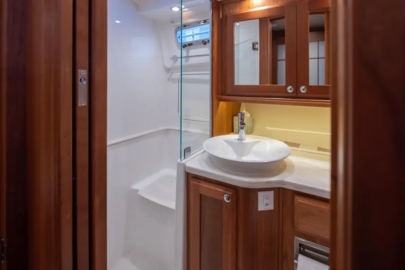 Slide: The Image of Luxurious bathroom in 2020 Sabre 45 Salon Express yacht with modern fixtures and wood cabinetry. - 34
