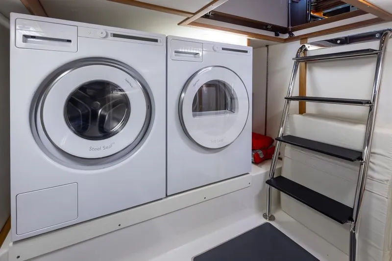 Slide: The Image of Laundry area with washer and dryer in 2020 Sabre 45 Salon Express yacht. - 41