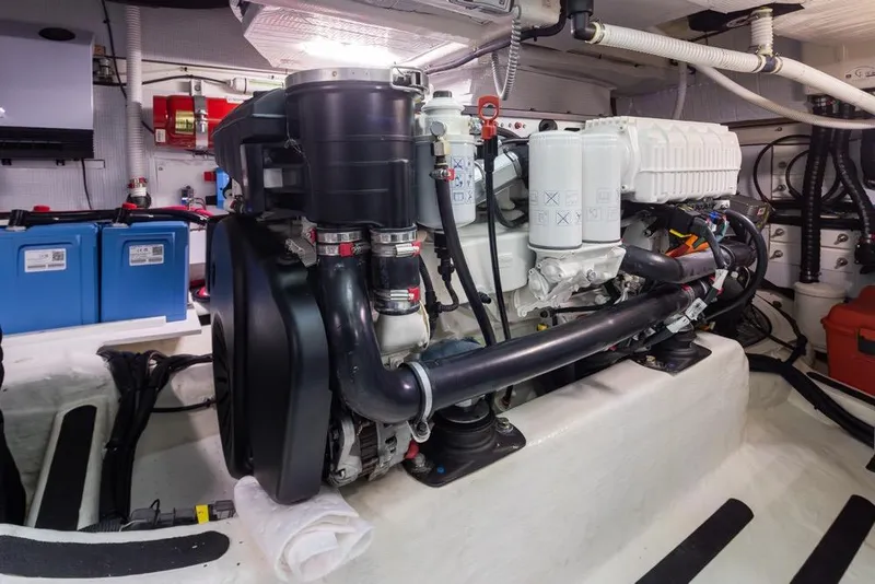 Slide: The Image of Engine room of 2020 Sabre 45 Salon Express yacht, showcasing mechanical components and systems. - 45
