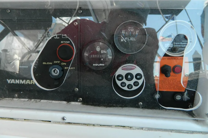Slide: The Image of Control panel of a 2007 Hunter 41 AC sailboat with Yanmar engine indicators. - 12