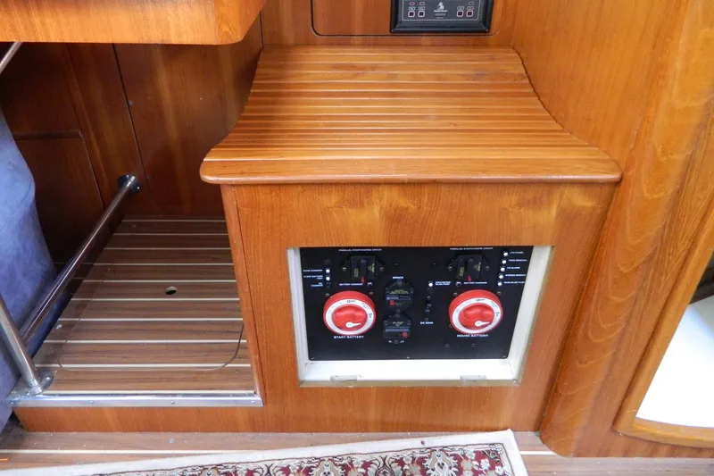 Slide: The Image of Control panel in a 2007 Hunter 41 AC sailboat interior with wooden finish. - 14