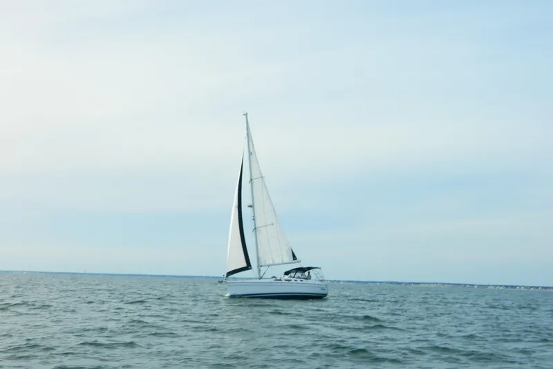 Slide: The Image of Sailboat Hunter 41 AC 2007 on open water under clear sky. - 2