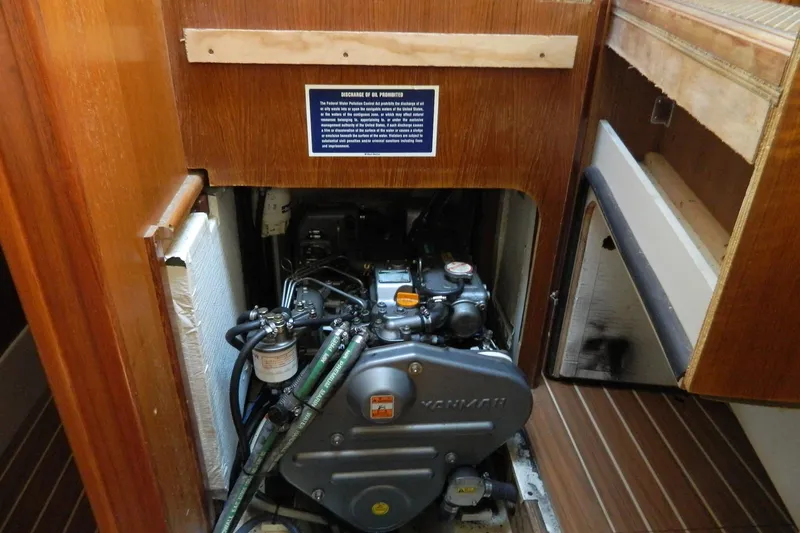 Slide: The Image of Engine compartment of a 2007 Hunter 41 AC sailboat, featuring a Yanmar engine. - 22