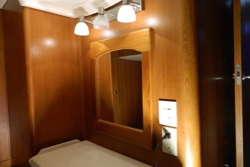 Slide: The Image of Interior of 2007 Hunter 41 Aft Cockpit yacht with wooden paneling and mirror. - 29