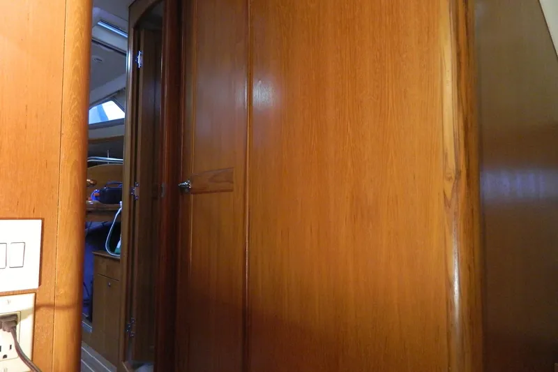 Slide: The Image of Interior view of 2007 Hunter 41 Aft Cockpit sailboat with wooden paneling. - 30