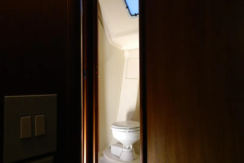 Slide: The Image of 2007 Hunter 41 Aft Cockpit yacht bathroom interior with toilet and skylight. - 31