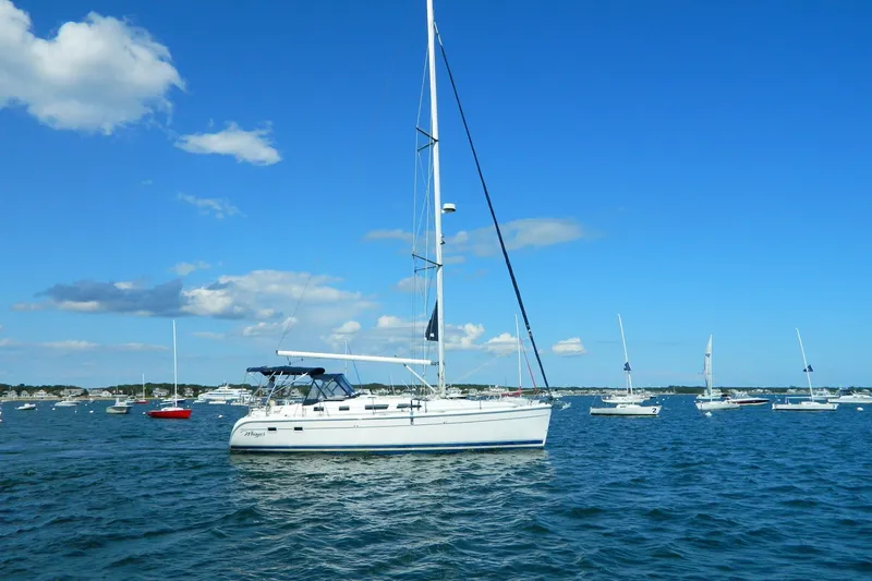 Slide: The Image of 2007 Hunter 41 AC sailboat on calm blue waters under a clear sky. - 4