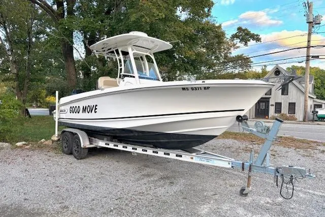 The Image of 2018 Boston Whaler 230 Outrage boat on trailer, parked outdoors. - 0