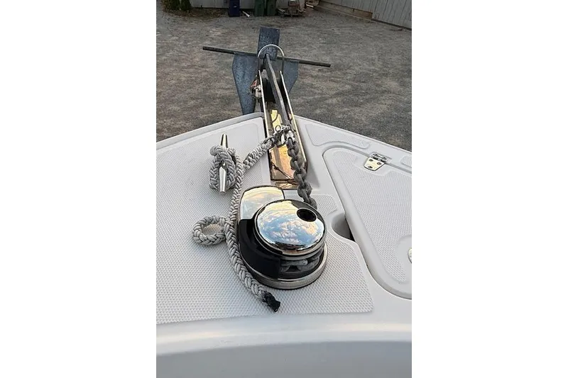 Slide: The Image of Boston Whaler 230 Outrage 2018 boat anchor and winch system on deck. - 13