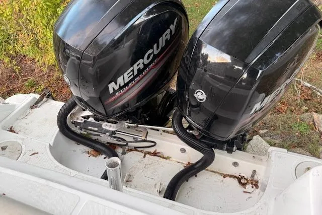 Slide: The Image of Twin Mercury outboard engines on a 2018 Boston Whaler 230 Outrage boat. - 15