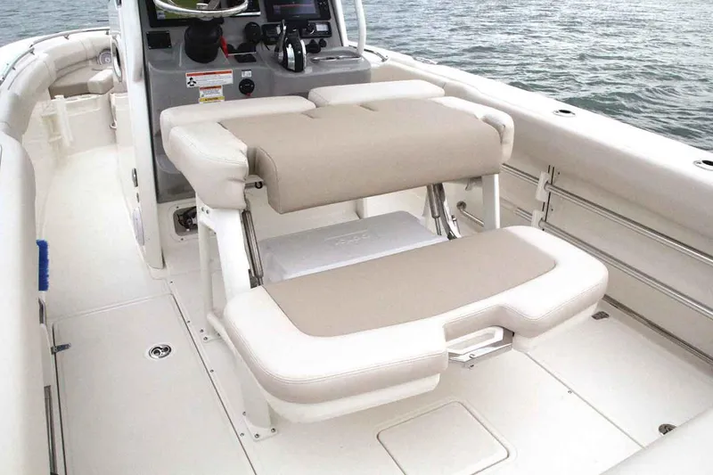 Slide: The Image of Manufacturer Provided Image: 2018 Boston Whaler 230 Outrage boat interior with cushioned seating. - 18