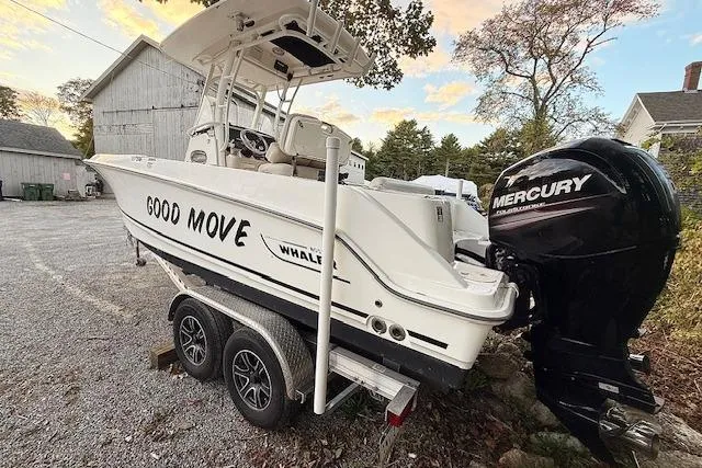 Slide: The Image of 2018 Boston Whaler 230 Outrage boat on trailer with Mercury engine, labeled "Good Move." - 3