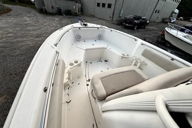 Slide: The Image of 2018 Boston Whaler 230 Outrage boat interior with seating and cup holders. - 5