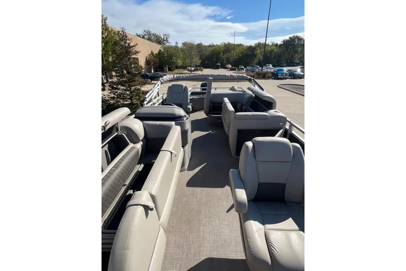 Slide: The Image of 2024 Sun Tracker SportFish 20 DLX pontoon boat with spacious seating and modern design. - 3