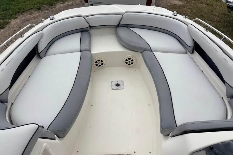 Slide: The Image of 2007 Bayliner 217 Deck Boat interior with spacious seating and modern design. - 10