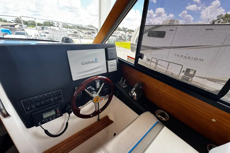 Slide: The Image of 2019 Cutwater C-28 boat helm with Garmin navigation system and steering wheel. - 5