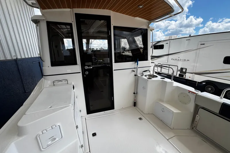 Slide: The Image of 2019 Cutwater C-28 boat deck with sleek design and modern amenities. - 7