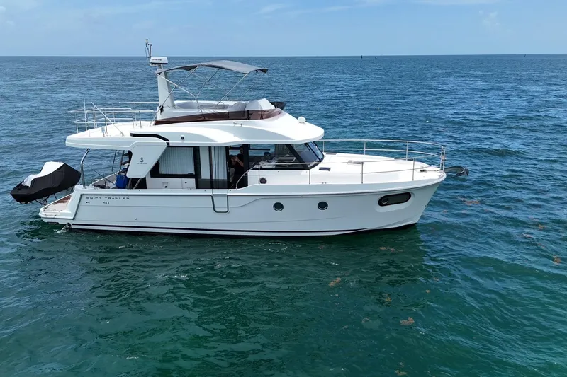 Slide: The Image of 2021 Beneteau Swift Trawler 41 Fly cruising on open sea. - 1