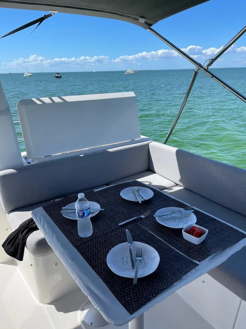 Slide: The Image of Beneteau Swift Trawler 41 Fly 2021 dining area with ocean view. - 17