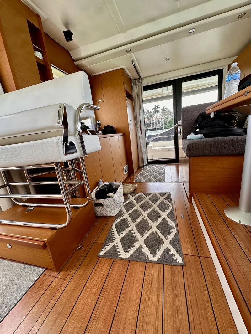 Slide: The Image of Interior of 2021 Beneteau Swift Trawler 41 Fly with wooden flooring and modern design. - 26