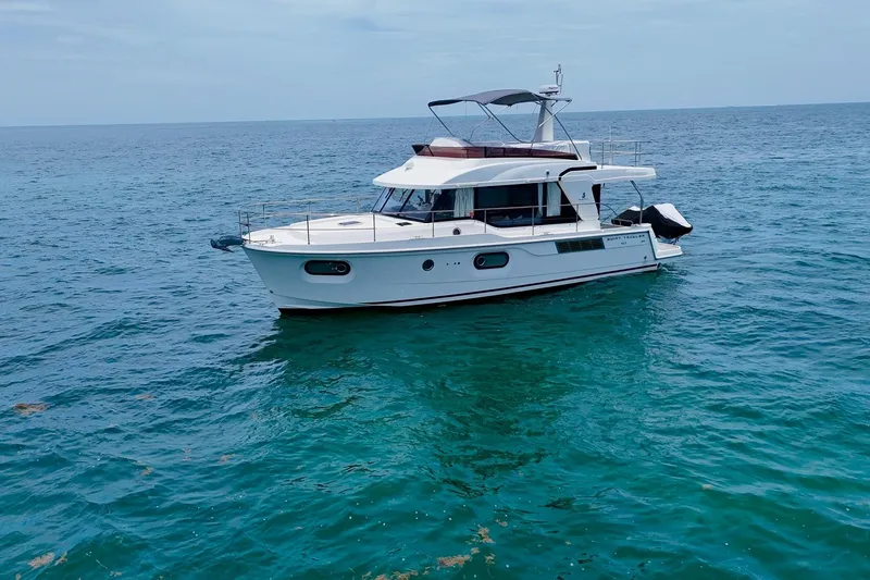 Slide: The Image of 2021 Beneteau Swift Trawler 41 Fly cruising on open sea. - 6