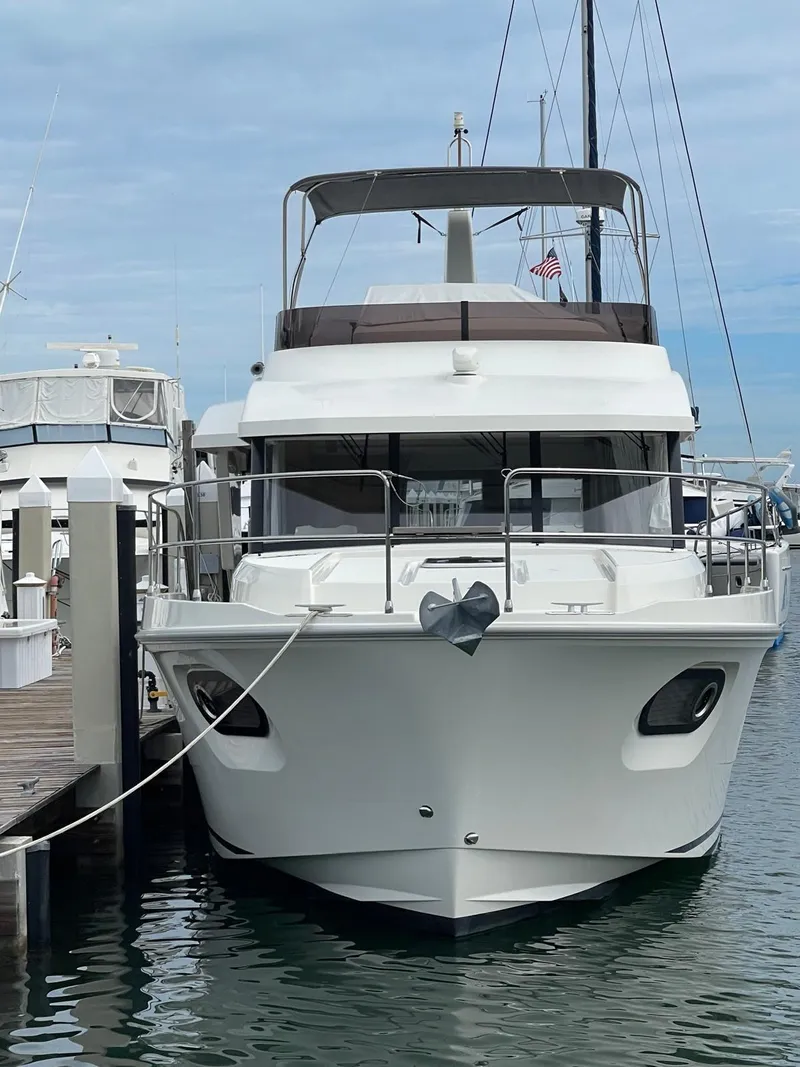 Slide: The Image of 2021 Beneteau Swift Trawler 41 Fly docked at marina. - 9
