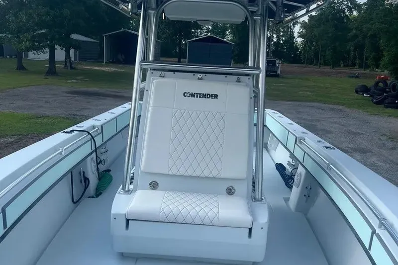 Slide: The Image of 2011 Contender 32 ST boat interior with white seating and sleek design. - 7