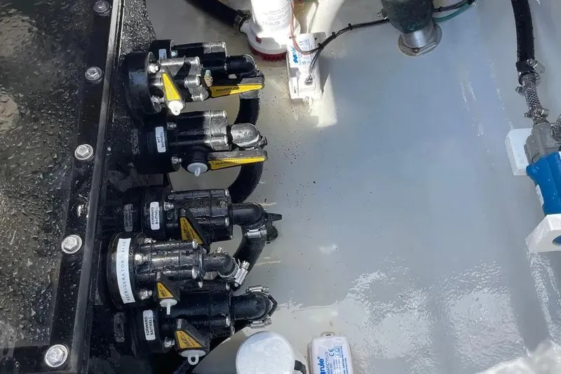 Slide: The Image of 2023 SeaVee 390Z boat interior showing mechanical components and valves. - 8