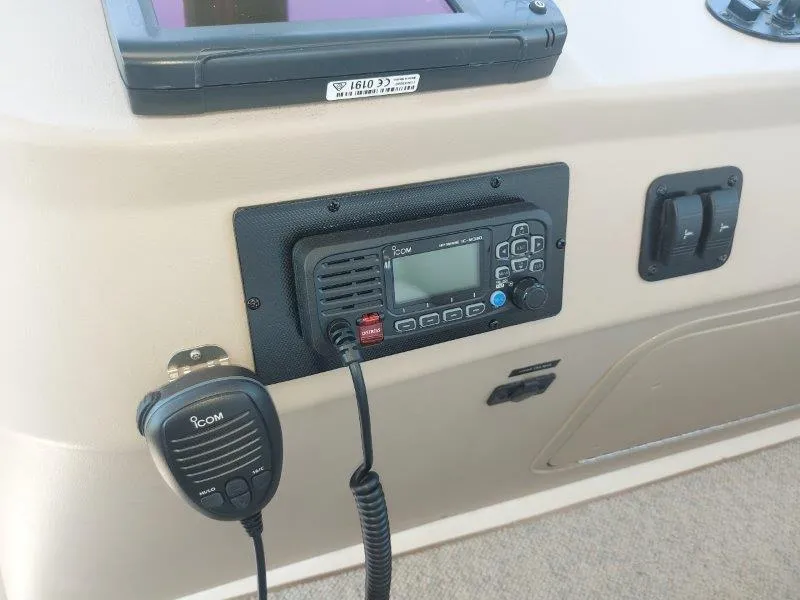 Slide: The Image of ICOM radio system on 1999 Sea Ray 340 Sundancer boat dashboard. - 35