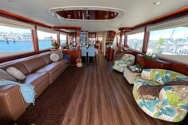 Slide: The Image of Luxurious 2004 Lazzara SC Motor Yacht interior with elegant seating and panoramic windows. - 10