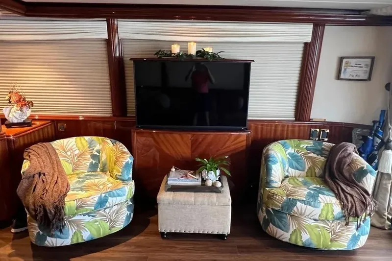 Slide: The Image of Luxurious 2004 Lazzara SC Motor Yacht interior with tropical chairs and modern decor. - 13