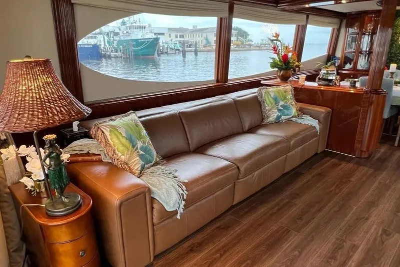 Slide: The Image of Luxurious interior of 2004 Lazzara SC Motor Yacht with leather sofa and waterfront view. - 14