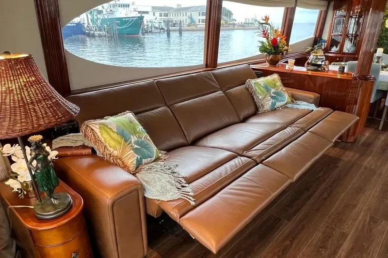 Slide: The Image of Luxurious interior of 2004 Lazzara SC Motor Yacht with leather sofa and waterfront view. - 15