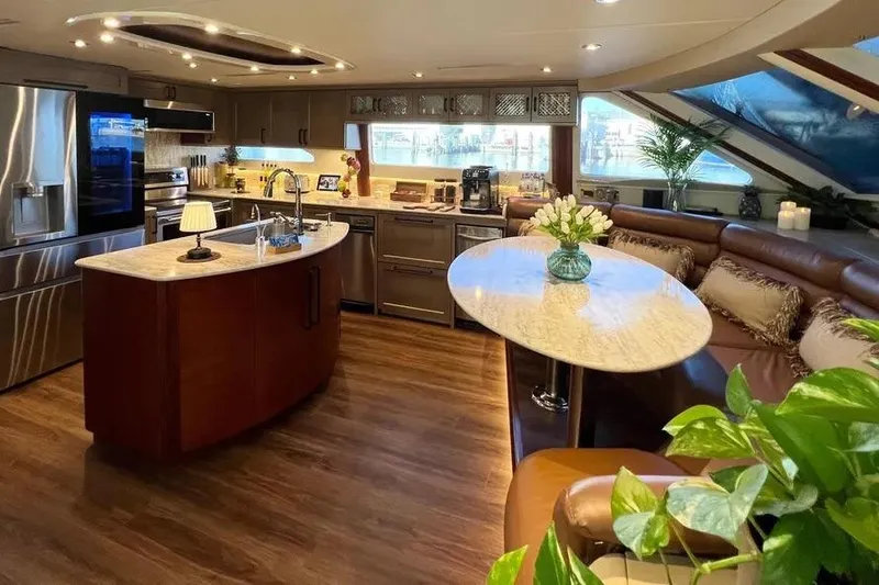 Slide: The Image of Luxurious 2004 Lazzara SC Motor Yacht interior with modern kitchen and elegant seating area. - 17