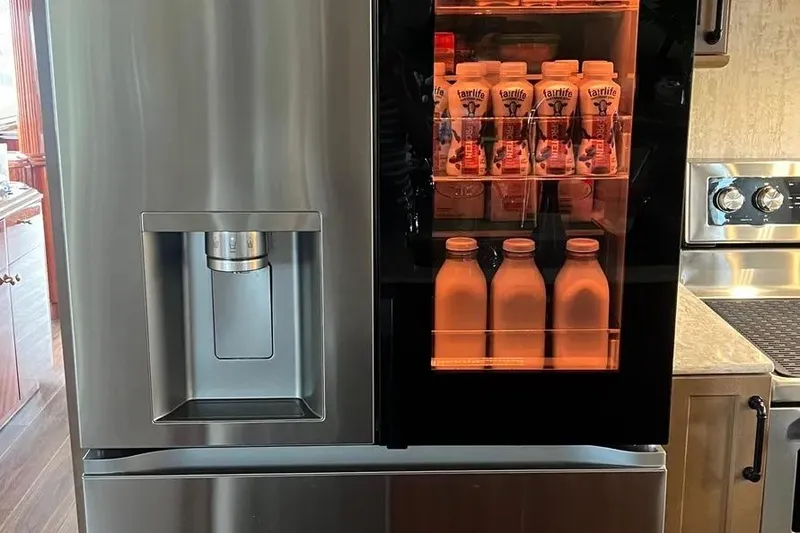 Slide: The Image of Stainless steel refrigerator on 2004 Lazzara SC Motor Yacht, stocked with beverages. - 25