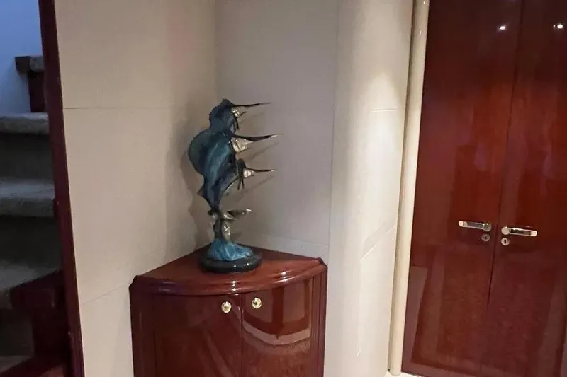 Slide: The Image of Interior of 2004 Lazzara SC Motor Yacht with decorative marlin sculpture and wooden cabinetry. - 29