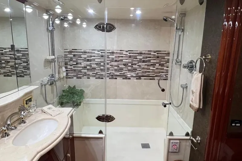 Slide: The Image of Luxurious bathroom in 2004 Lazzara SC Motor Yacht with glass shower and elegant fixtures. - 31