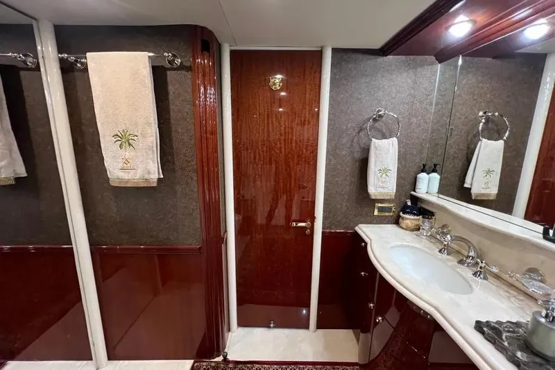 Slide: The Image of Luxurious bathroom in 2004 Lazzara SC Motor Yacht with elegant wood finishes and plush towels. - 35