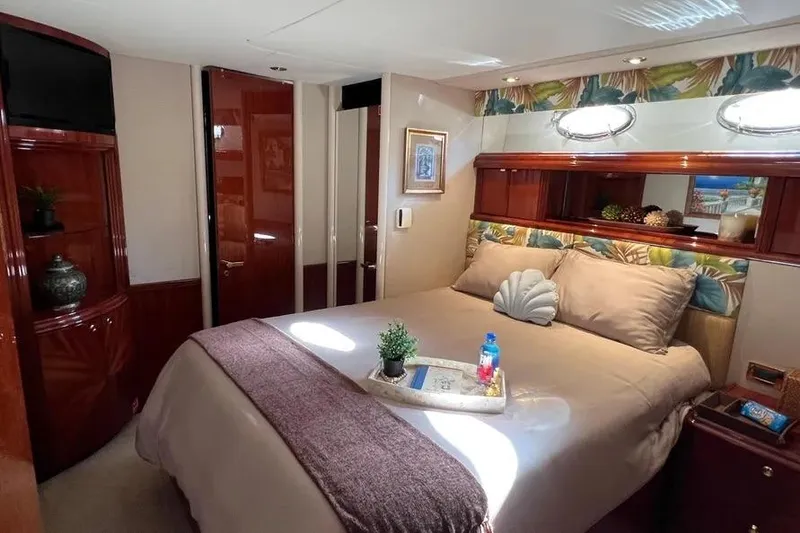 Slide: The Image of Luxurious bedroom interior of 2004 Lazzara SC Motor Yacht with elegant decor and cozy bedding. - 38