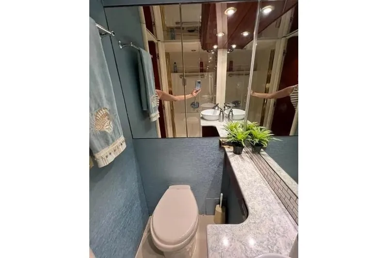 Slide: The Image of Bathroom interior of 2004 Lazzara SC Motor Yacht with modern fixtures and decor. - 40