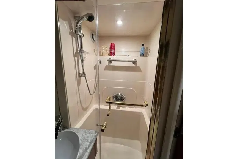 Slide: The Image of Bathroom shower in 2004 Lazzara SC Motor Yacht with modern fixtures and toiletries. - 42