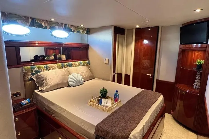Slide: The Image of Luxurious bedroom interior of 2004 Lazzara SC Motor Yacht with elegant decor and amenities. - 43