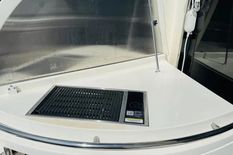 Slide: The Image of Outdoor grill on 2004 Lazzara SC Motor Yacht deck, featuring sleek design and modern amenities. - 59