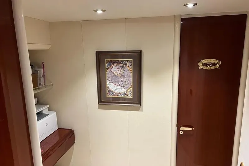 Slide: The Image of Interior of 2004 Lazzara SC Motor Yacht with framed map and wooden door. - 61