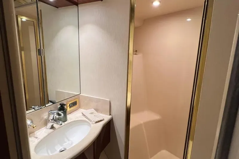 Slide: The Image of Luxurious bathroom in 2004 Lazzara SC Motor Yacht with elegant fixtures and lighting. - 63