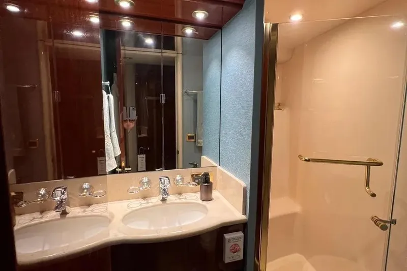 Slide: The Image of Luxurious bathroom in 2004 Lazzara SC Motor Yacht with double sinks and glass shower. - 67